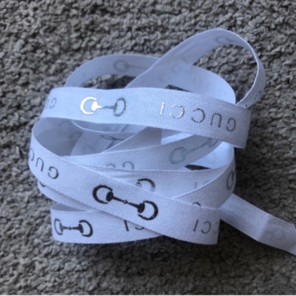 Authentic Gucci Ribbon. White with metallic horsebit motif and Gucci Logo.152cm.